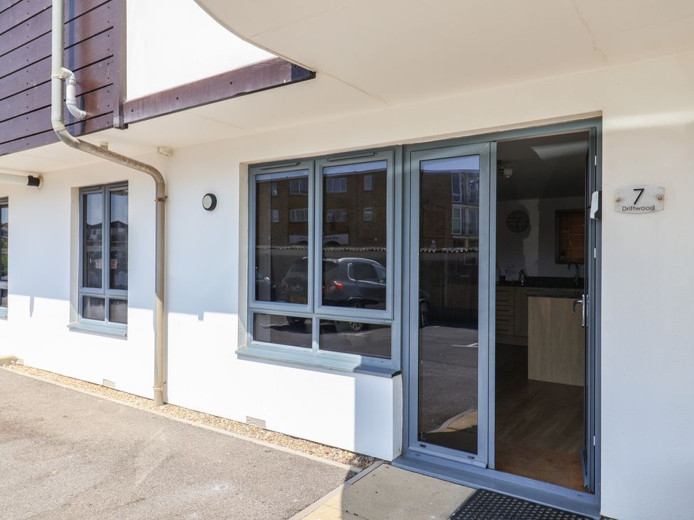 An entrance area with door and windows at Harbourwalk in West Bay