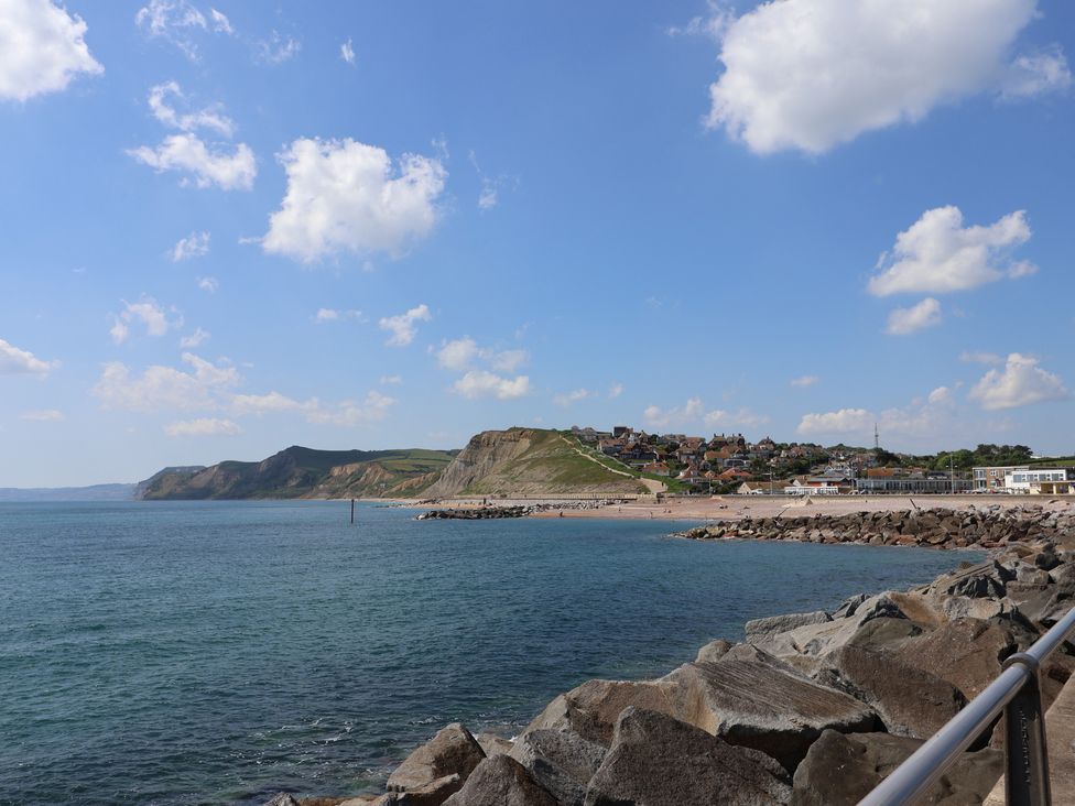 A view of the beach and cliffs at Harbourwalk in West Bay