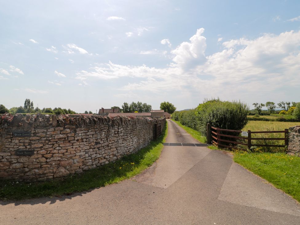 A path leading through a stone wall and gate at Robins Corner Bleadon