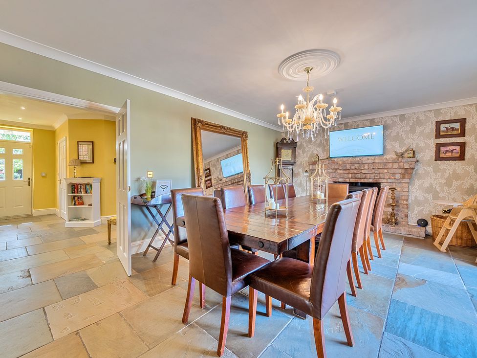 A dining room with a large table and chairs at Moor End Manor Stalmine