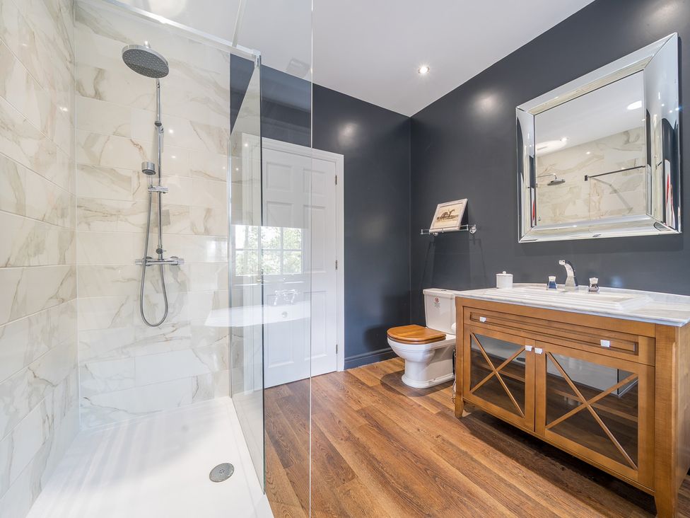 A bathroom with shower and vanity at Moor End Manor in Stalmine