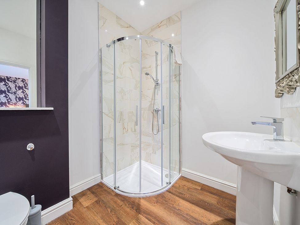 A bathroom with a shower and sink at Moor End Manor in Stalmine