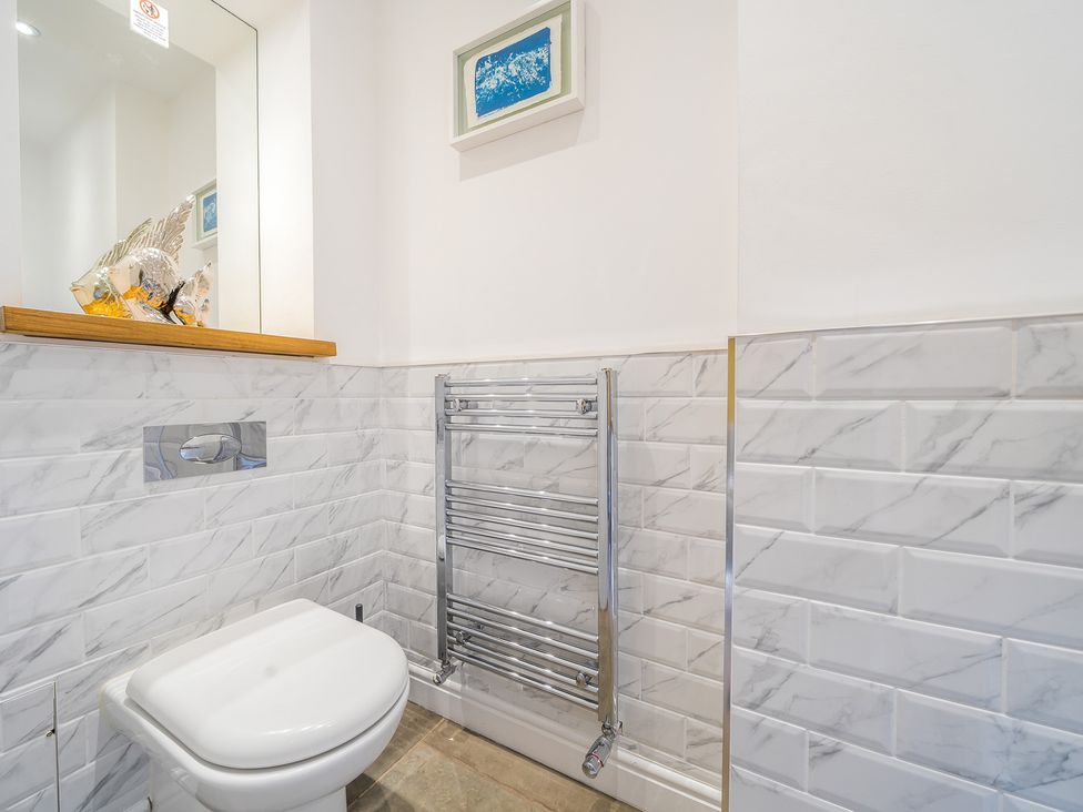 A bathroom with a toilet and towel radiator at Moor End Manor Stalmine