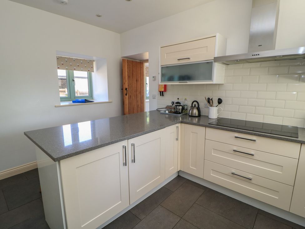 A kitchen with countertop, kettle, and cabinets at Dale Barton in Wells