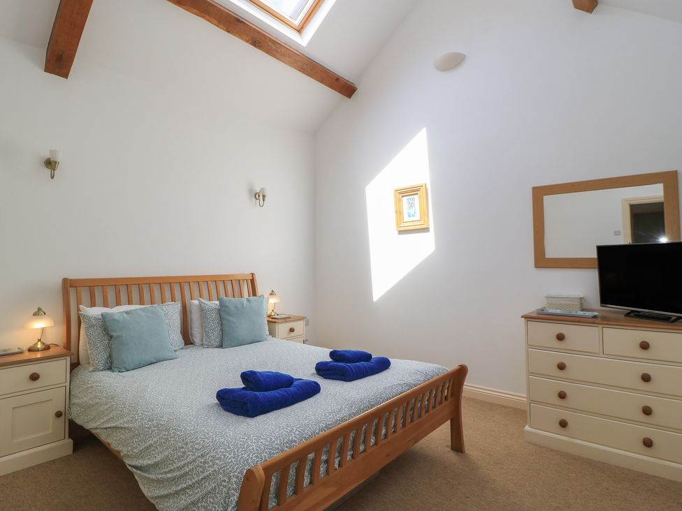 A bedroom with a bed and television at Dale Barton in Wells