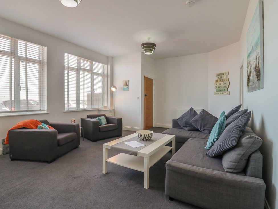 A living room with sofas and a coffee table at 38 The Parade in Walton-On-The-Naze