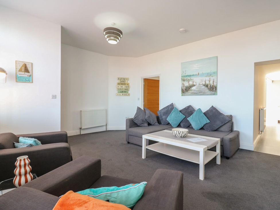 A living room with a sofa and coffee table at 38 The Parade Walton-On-The-Naze