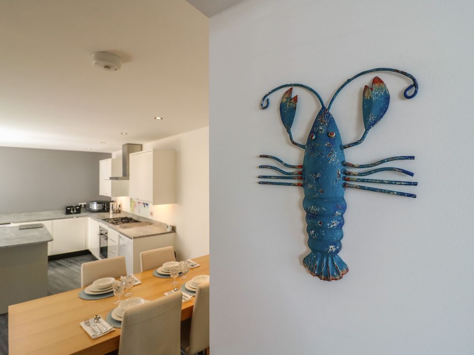 A kitchen with a lobster decoration on the wall at 38 The Parade Walton-On-The-Naze