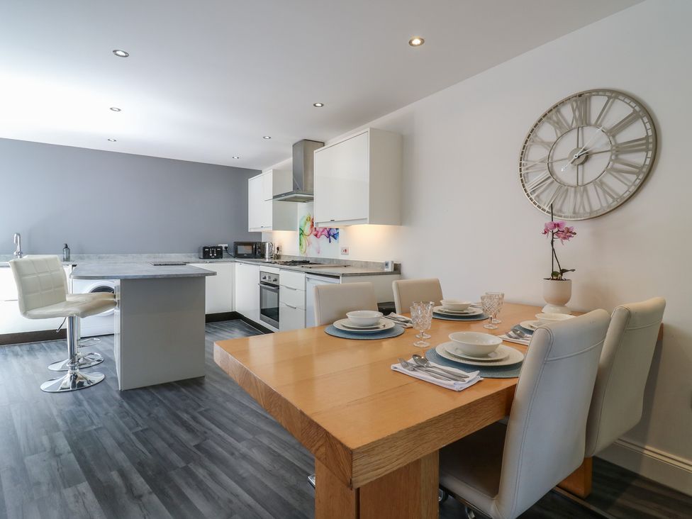 A kitchen with dining area at 38 The Parade in Walton-On-The-Naze