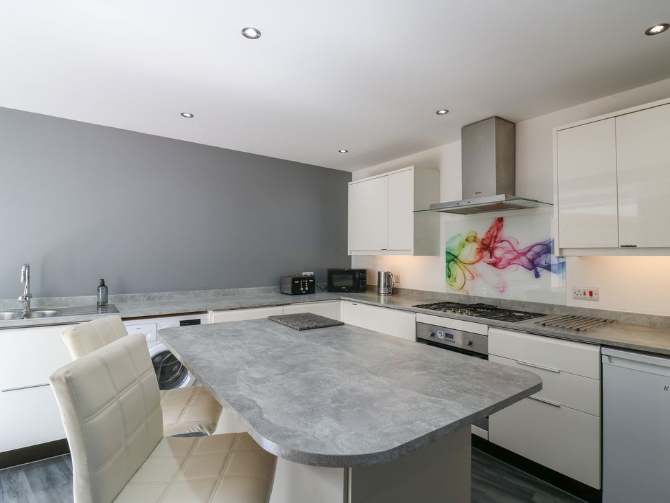 A kitchen with modern appliances at 38 The Parade Walton-On-The-Naze