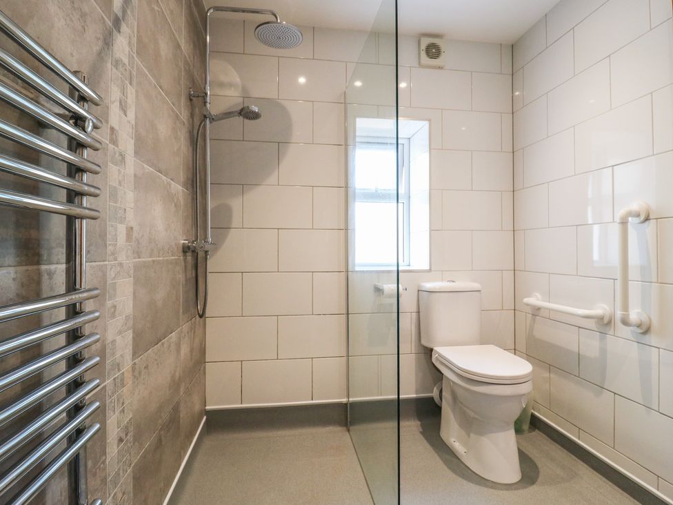 A bathroom with shower and toilet at 38 The Parade Walton-On-The-Naze