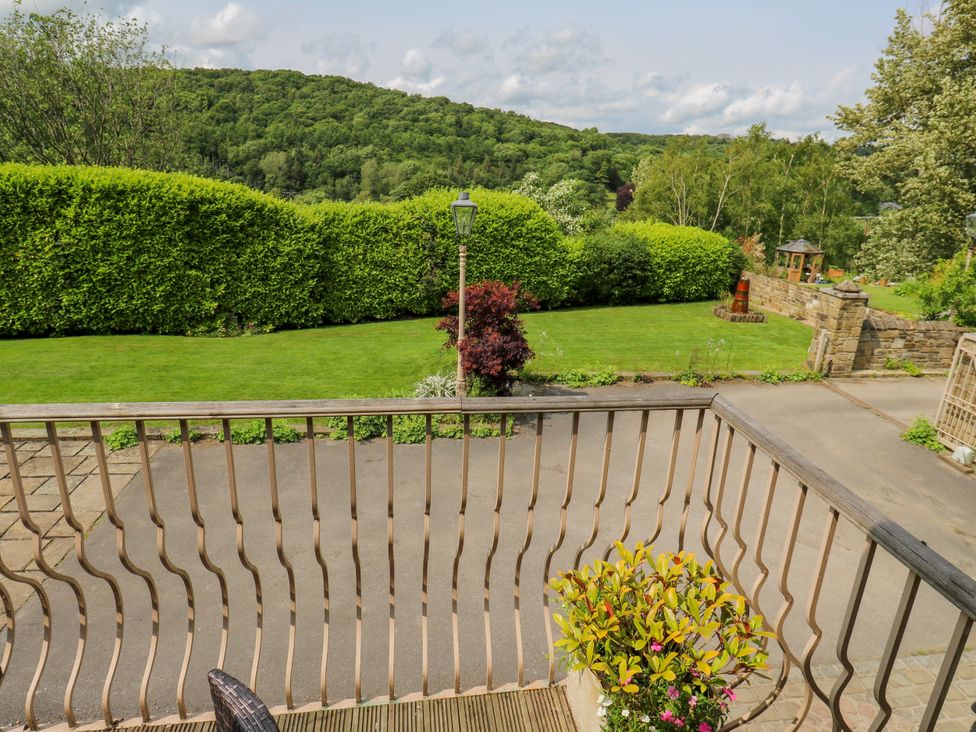 A balcony view overlooking a garden at Woodbottom Farm Meltham