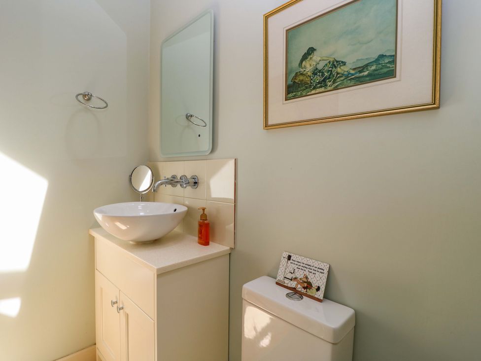 A bathroom with a sink and toilet at Pheasant Cottage in Priston Village, BATH