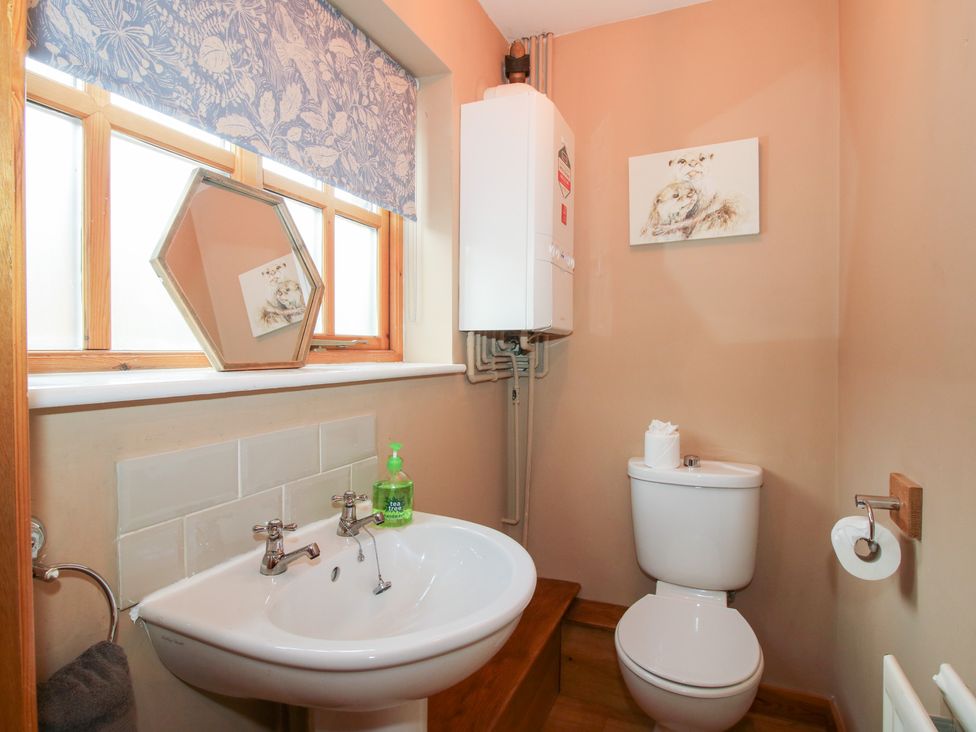 A bathroom with sink and toilet at Old Hall Barn 2 Church Stretton