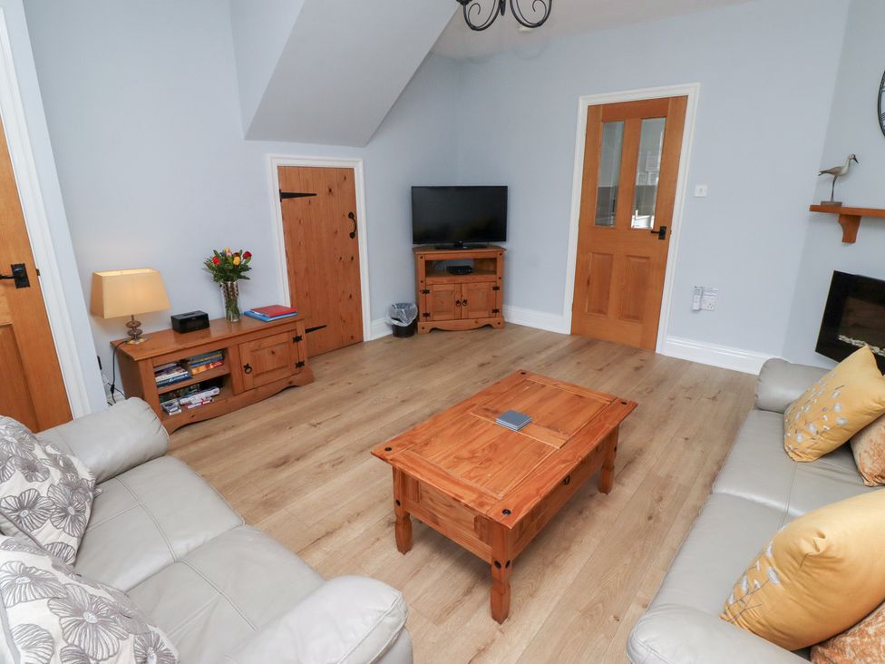 A living room with a sofa and coffee table at Hasting Dairy near North Sunderland