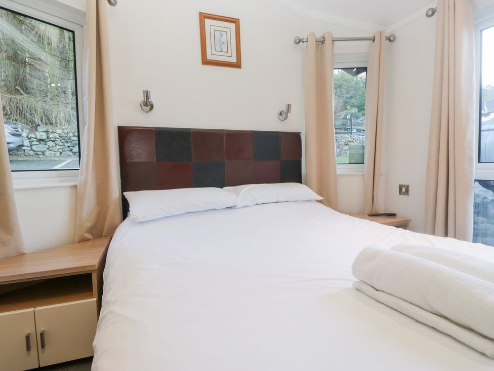 A bedroom with a bed and window at Heights View