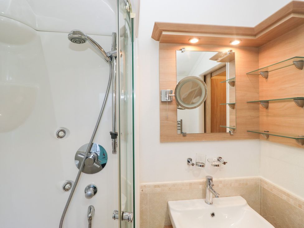 A bathroom with a shower and sink at Heights View