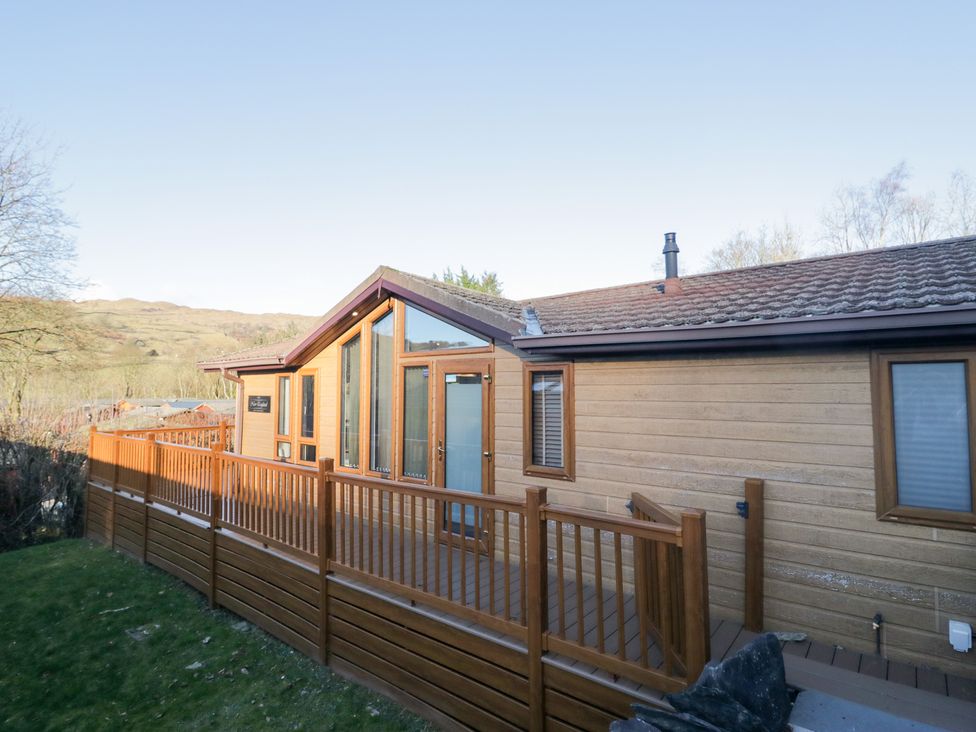 An exterior view of a cabin with a deck at Heights View 