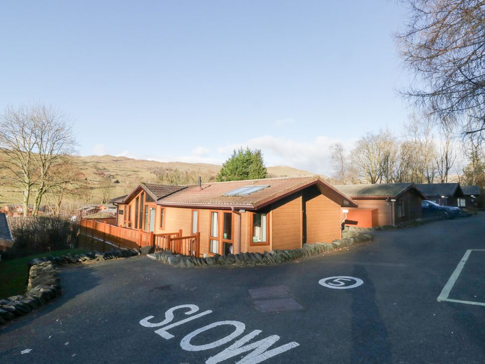 A lodge with solar panels and trees at Heights View