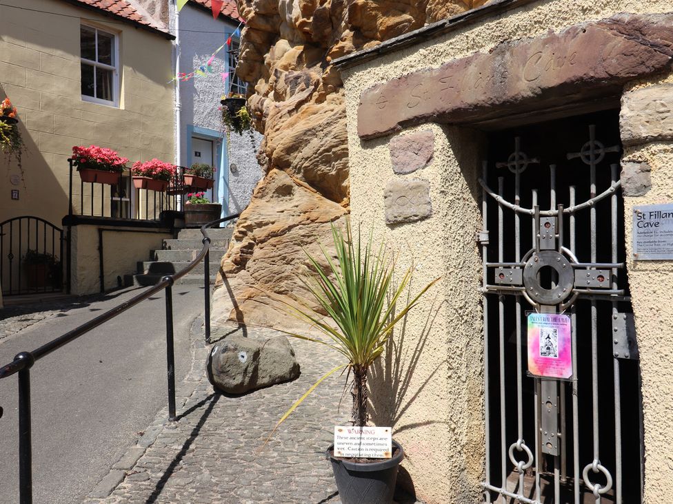 An outdoor area with a cave entrance at Maimie’s Harbourview Pittenweem near Anstruther