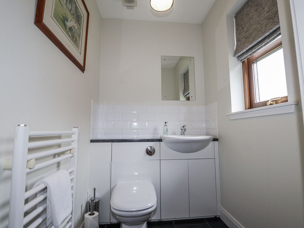 A bathroom with sink and toilet at Burnside House in Aviemore