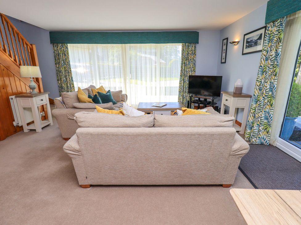 A living room with a sofa and coffee table at Waterhead Cottage, Ecclerigg, near Troutbeck Bridge