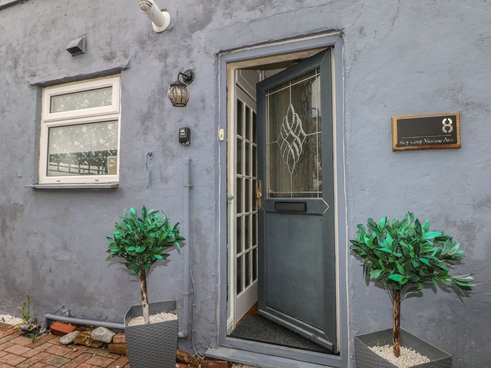 An entrance with plants and door at Bay Cosy in Pevensey Bay