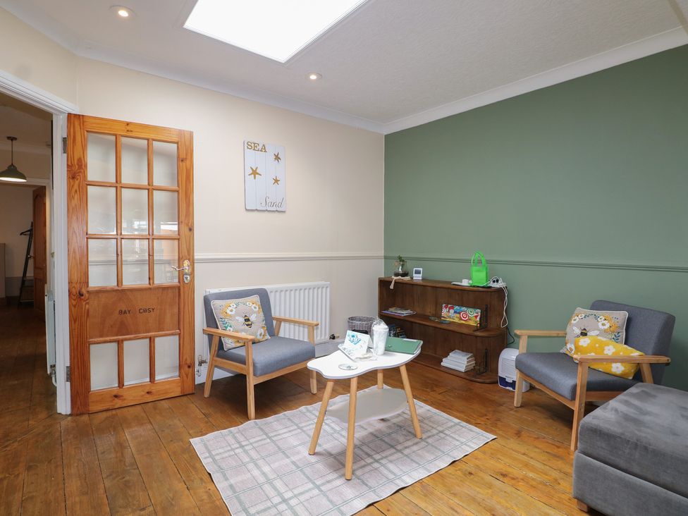 A living room with a table and chairs at Bay Cosy in Pevensey Bay