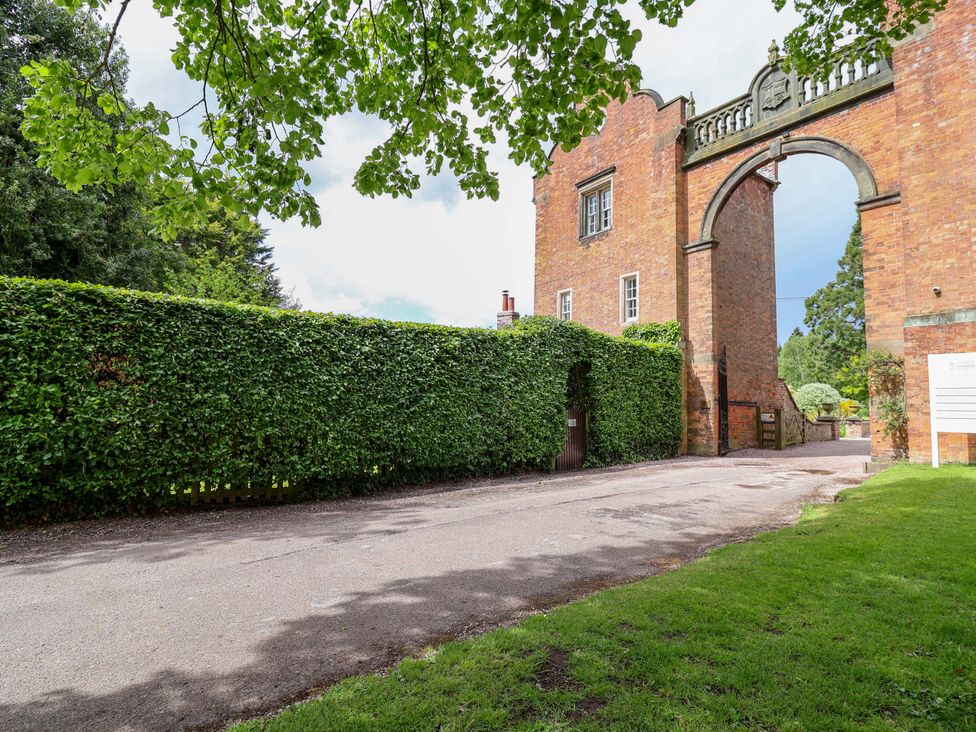 A view of a gate and hedge at South Tower Cottage in Capesthorne near Macclesfield