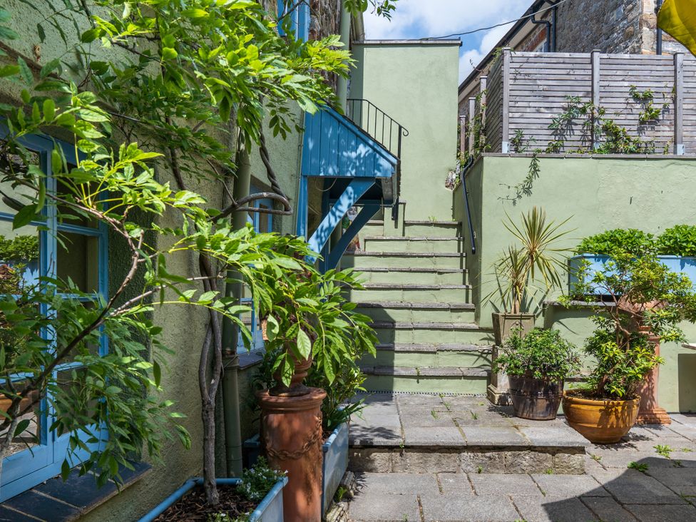 An outdoor area with stairs and planters at The Meeting House in Ashburton