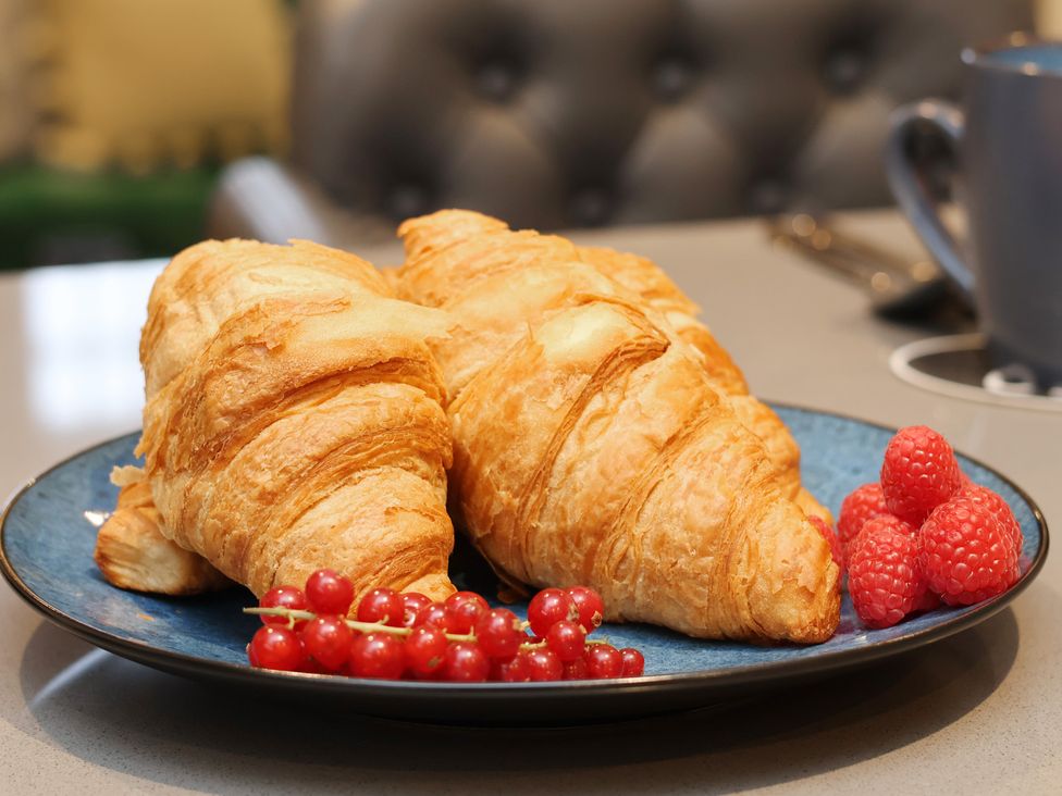 A plate with two croissants and berries at Premier, Transit & Lady Hilda @ Engine Shed, Whitby