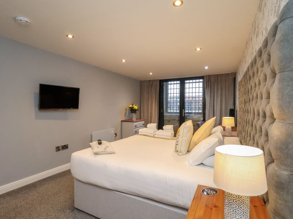 A bedroom with a bed and television at Premier, Transit & Lady Hilda @ Engine Shed, Whitby