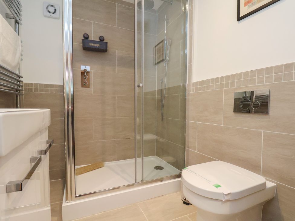 A bathroom with a shower and toilet at Premier, Transit & Lady Hilda @ Engine Shed, Whitby