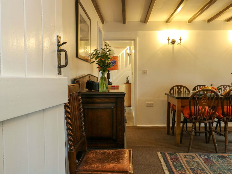 A dining room with a table and chairs at Ael Y Bryn Menai Bridge