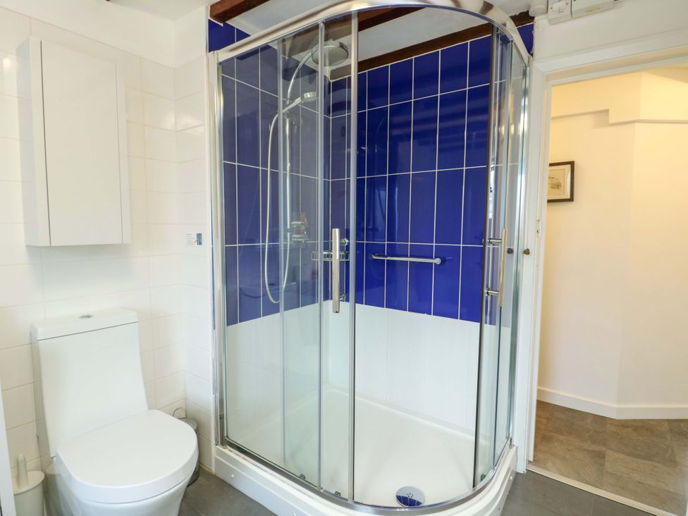 A bathroom with a shower and toilet at Ael Y Bryn in Menai Bridge