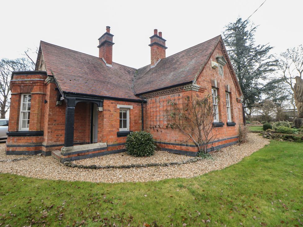 A house with brick exterior and garden at South Lodge - Longford Hall Farm Holiday Cottages Longford near Ashbourne