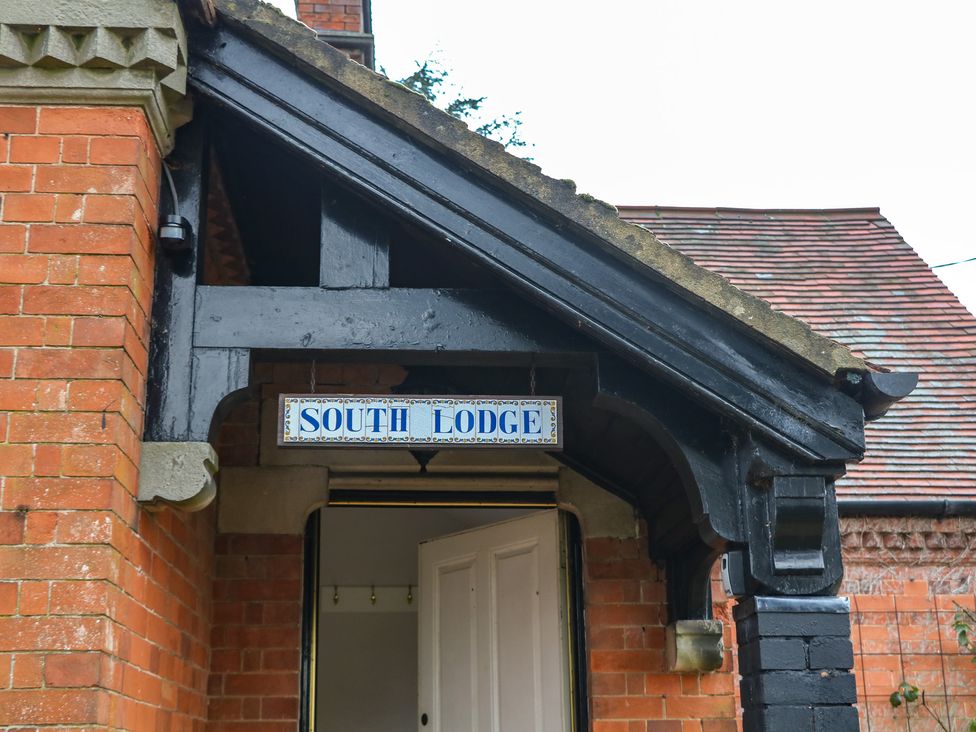 An entrance with a sign reading South Lodge at South Lodge - Longford Hall Farm Holiday Cottages Longford near Ashbourne