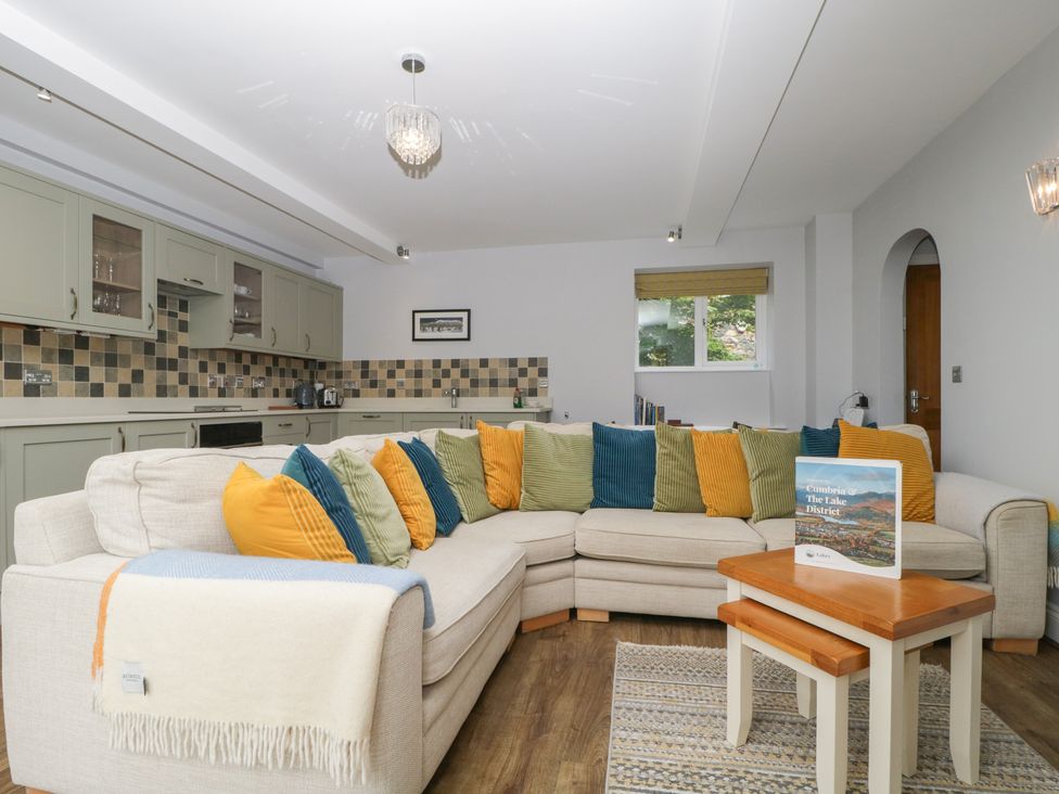 A living room with a sofa and coffee table at High Spy in Keswick