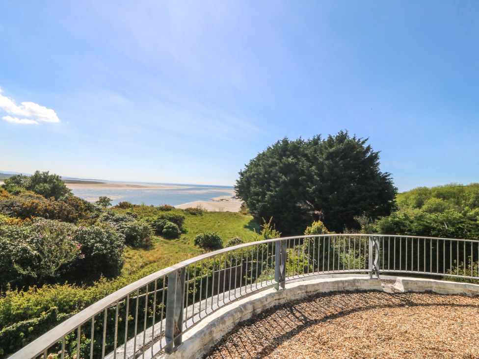 A view of the sea and beach from a balcony at Bryn Y Mor, Borth Y Gest