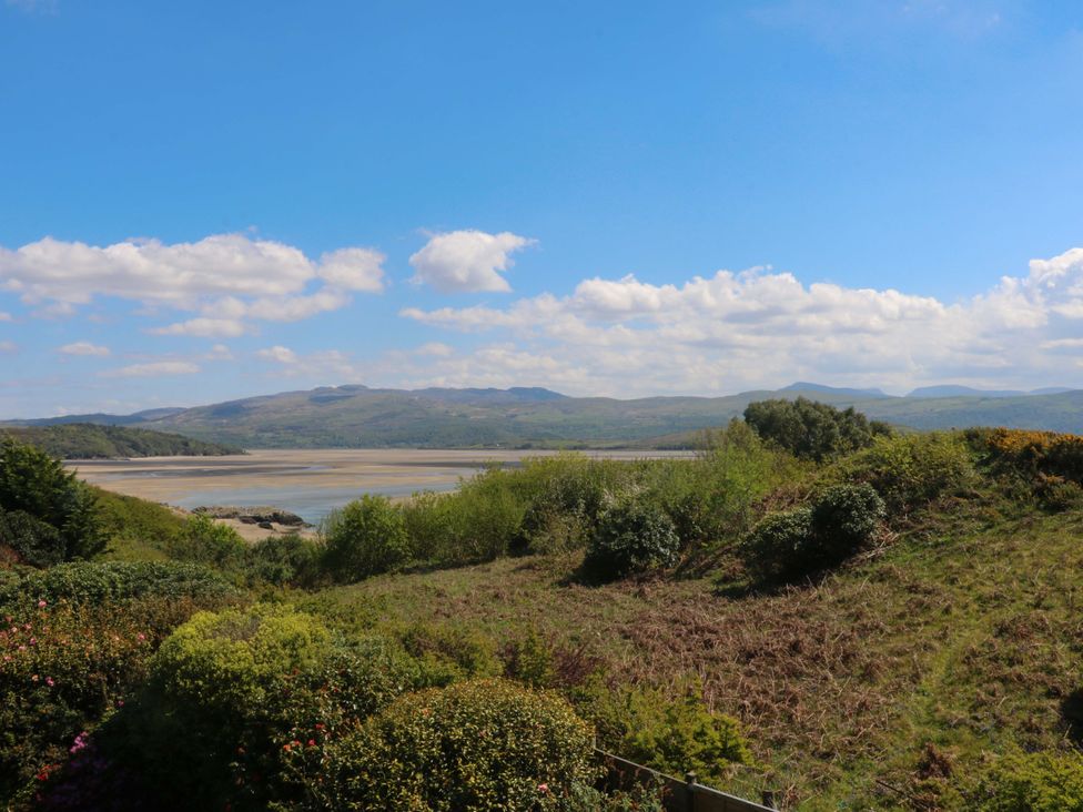 A view of mountains and water with greenery at Bryn Y Mor, Borth Y Gest