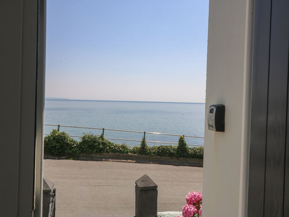 View of the sea and pathway at Captain's Rest in Criccieth