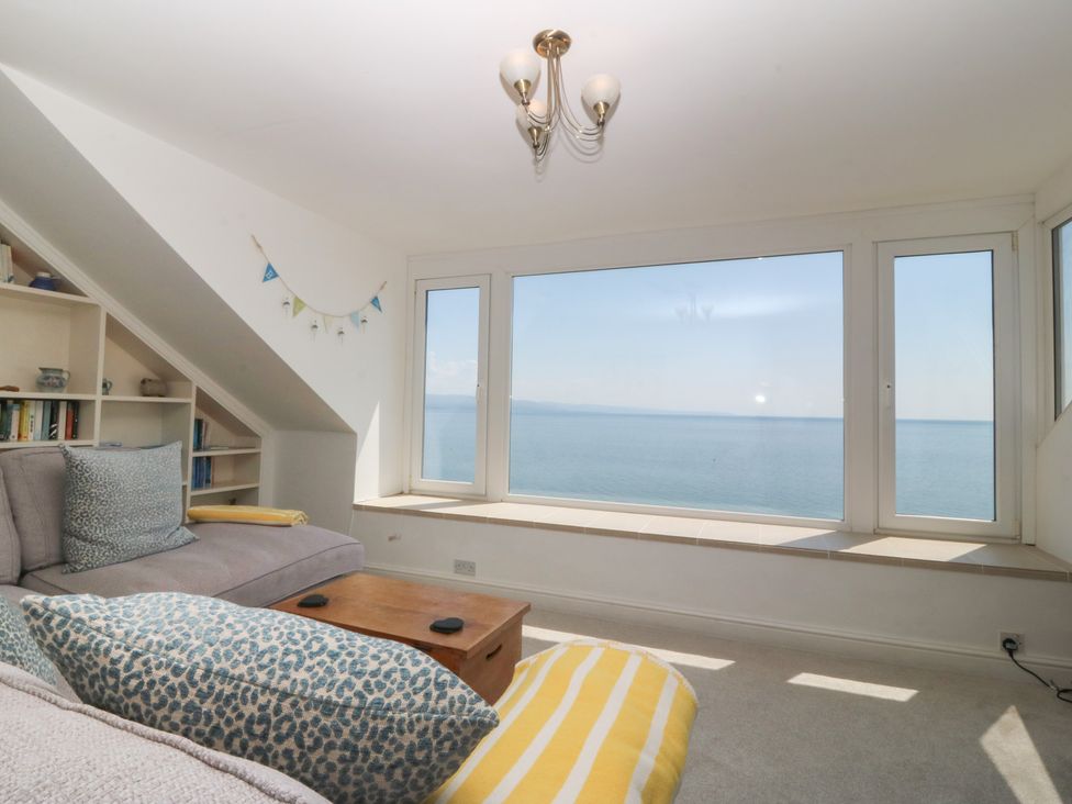 A living room with a view of the sea at Captain's Rest in Criccieth