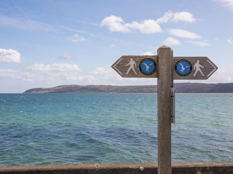 A signpost directing pedestrians at Pen y Bont Bach Red Wharf Bay