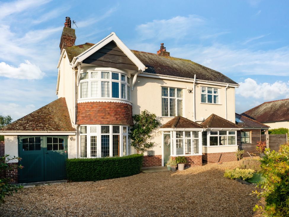 A house with a front yard and garage at Summerfield in Deganwy