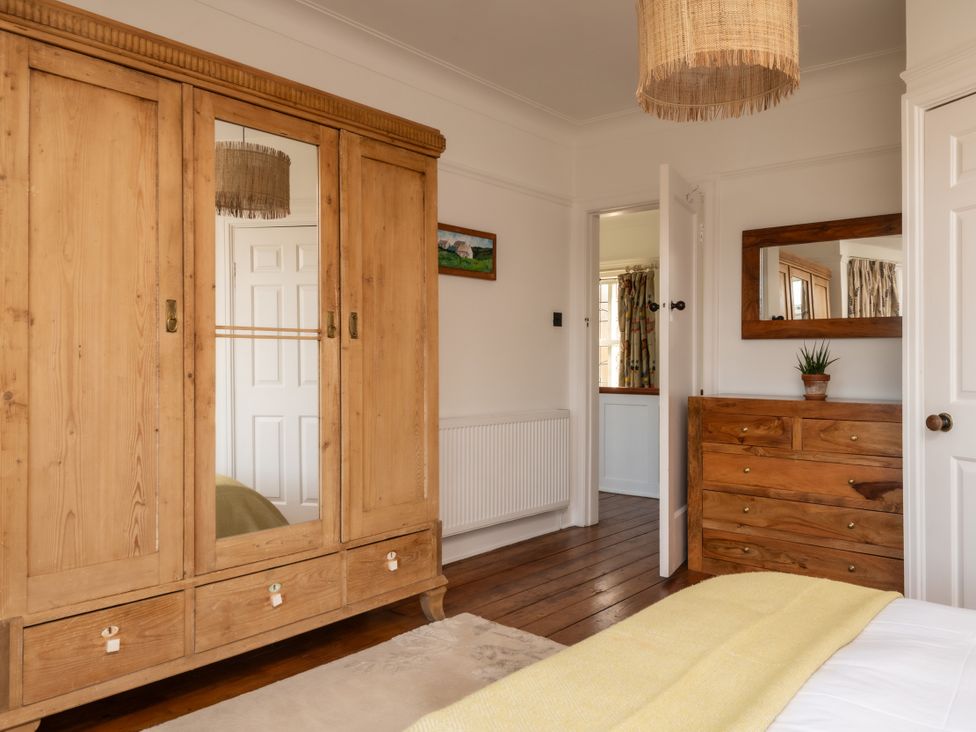 A bedroom featuring a wardrobe and dressing table at Summerfield in Deganwy
