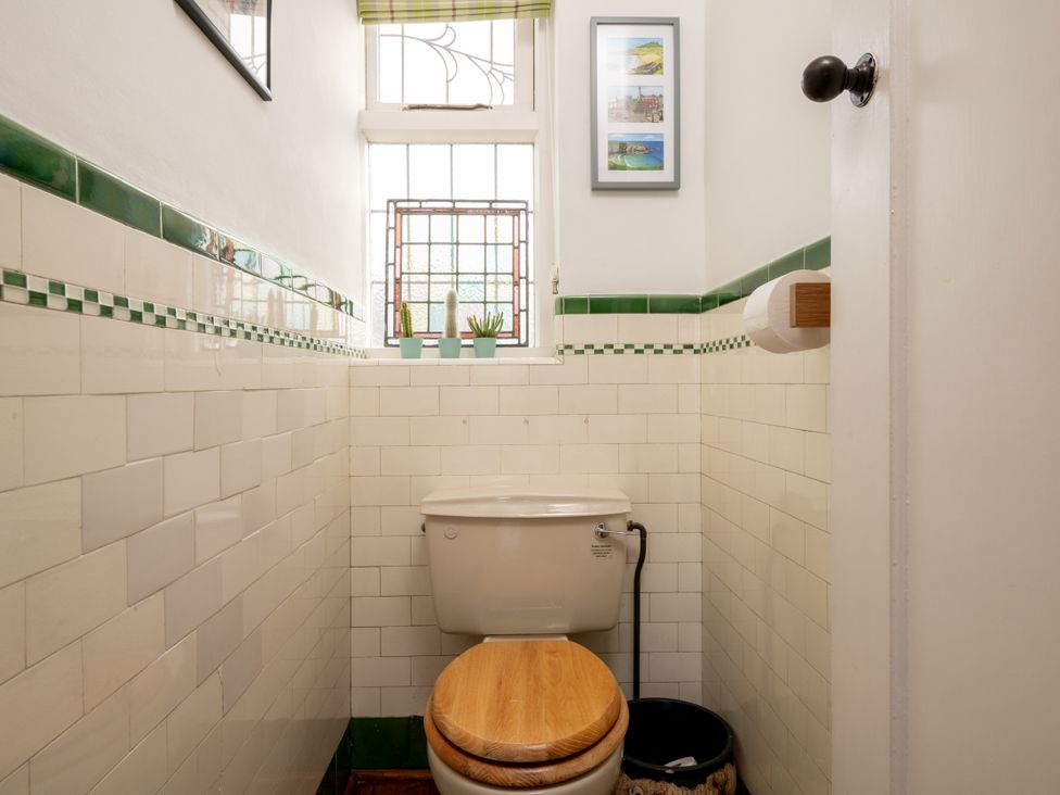 A toilet with a window in a bathroom at Summerfield in Deganwy