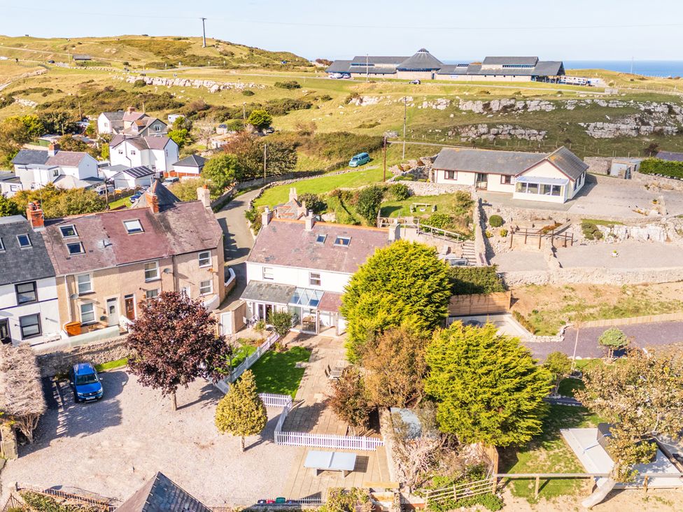 An outdoor area with houses and trees at Ty Bach, Great Orme in Llandudno