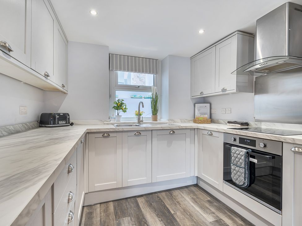 A kitchen with countertop and appliances at Ty Mawr, Great Orme Llandudno