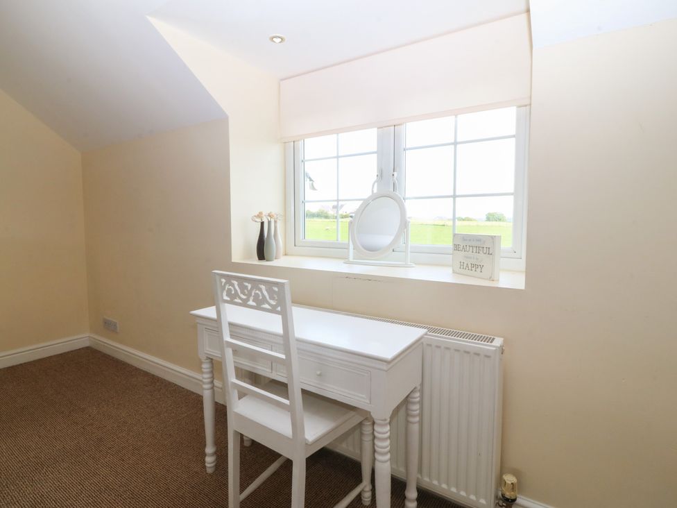 An office with a white desk and chair at Llanallgo Church Rooms