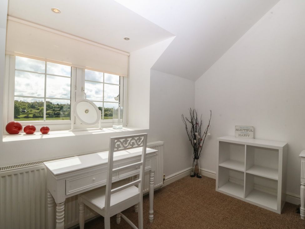 An office with a desk and chair at Llanallgo Church Rooms